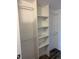 Organized walk-in closet with ample shelving and hanging space for optimal storage solutions at 3460 S Poplar St # 404, Denver, CO 80224