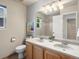 Bright bathroom featuring a double vanity, neutral walls, and a shower/tub combo at 2548 Foothills Canyon Ct, Highlands Ranch, CO 80129