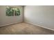This bedroom has a light gray walls, carpeted floor, and window providing natural light at 2548 Foothills Canyon Ct, Highlands Ranch, CO 80129