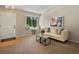 Bright living room featuring a comfortable sofa, a window seat, and tasteful decor at 2548 Foothills Canyon Ct, Highlands Ranch, CO 80129