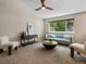 Stylish living room with vaulted ceilings, a unique coffee table, and comfortable seating at 2548 Foothills Canyon Ct, Highlands Ranch, CO 80129