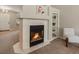Inviting living room with a fireplace, neutral tones, and an open layout at 2548 Foothills Canyon Ct, Highlands Ranch, CO 80129