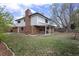 Expansive backyard with a swing and a cozy covered patio perfect for outdoor entertaining or relaxing at 1581 S Kendall St, Lakewood, CO 80232