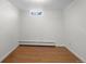 Empty basement featuring a single window and laminate flooring at 1581 S Kendall St, Lakewood, CO 80232