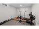 Spacious basement gym equipped with weightlifting equipment and padded flooring at 1581 S Kendall St, Lakewood, CO 80232