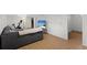 Finished basement with modern seating area, TV and exercise equipment at 1581 S Kendall St, Lakewood, CO 80232