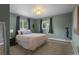 Inviting bedroom with plush carpet, neutral colored walls, and large windows for natural light at 1581 S Kendall St, Lakewood, CO 80232