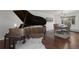 Dining room showcasing a grand piano and an elegant chandelier at 1581 S Kendall St, Lakewood, CO 80232