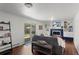 Cozy living room with custom built-ins, a modern fireplace, and access to the backyard at 1581 S Kendall St, Lakewood, CO 80232