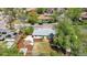 Aerial view of home with a fire pit area, deck, and nicely landscaped yard at 1860 W Iris Cir, Littleton, CO 80120