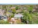 Overhead shot of a house with a large lawn, outdoor seating, and mature trees at 1860 W Iris Cir, Littleton, CO 80120