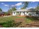 Well-maintained backyard with a wood deck, swing, and a grassy area at 1860 W Iris Cir, Littleton, CO 80120