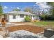 Expansive backyard featuring a deck, gravel patio, and lush landscaping at 1860 W Iris Cir, Littleton, CO 80120
