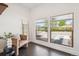 Sitting area with large windows offering lots of natural light and views of the neighborhood at 1860 W Iris Cir, Littleton, CO 80120