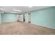 Finished basement featuring new carpeting and multiple access doors at 12289 W Dakota Dr, Lakewood, CO 80228
