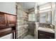 Modern bathroom featuring sleek shower, vanity, and wood-like porcelain design at 12289 W Dakota Dr, Lakewood, CO 80228