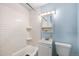 Clean bathroom with a tub/shower, white subway tile, and updated fixtures at 12289 W Dakota Dr, Lakewood, CO 80228