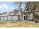 Charming two-story townhome with mature trees, three-car garage, and covered porch at 12560 E Warren Dr # E, Aurora, CO 80014