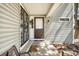 Inviting front porch with decorative metalwork, stylish door and exterior lighting at 12560 E Warren Dr # E, Aurora, CO 80014