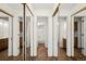 Mirrored hallway showcasing access to bathroom and other areas of the house at 12560 E Warren Dr # E, Aurora, CO 80014