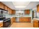 Updated kitchen featuring stainless steel appliances, bright countertops, and natural lighting at 12560 E Warren Dr # E, Aurora, CO 80014
