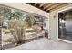 Covered back patio with view of the backyard and rock landscaping at 12560 E Warren Dr # E, Aurora, CO 80014