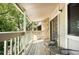 Inviting balcony with wooden deck and seating offers a serene outdoor retreat at 8225 Fairmount Dr # 10-203, Denver, CO 80247