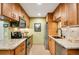 Well-appointed kitchen with stainless steel appliances, granite countertops, and ample cabinet space at 8225 Fairmount Dr # 10-203, Denver, CO 80247