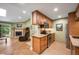 Open concept kitchen with island, granite countertops, and direct view into the living area at 8225 Fairmount Dr # 10-203, Denver, CO 80247