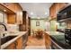 Well-designed kitchen with ample storage, dining area, stainless appliances, and granite countertops at 8225 Fairmount Dr # 10-203, Denver, CO 80247