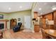 Inviting living room with fireplace that transitions to a modern kitchen and dining area at 8225 Fairmount Dr # 10-203, Denver, CO 80247