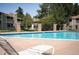 Inviting community pool with lounge chairs, perfect for relaxing and enjoying the outdoors at 8225 Fairmount Dr # 10-203, Denver, CO 80247