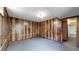 Basement features wood paneled walls, durable flooring, and access to other areas at 921 S Wheeling St, Aurora, CO 80012