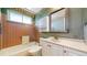 Bathroom with a tub/shower combo, vanity with a mirror, and coordinating tile at 921 S Wheeling St, Aurora, CO 80012
