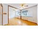 Bedroom featuring hardwood floors and a window with a street view at 921 S Wheeling St, Aurora, CO 80012