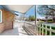 Inviting front porch with a white picket fence overlooking the neighborhood at 921 S Wheeling St, Aurora, CO 80012