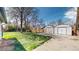 Large backyard features a big two-car detached garage and lush green space at 921 S Wheeling St, Aurora, CO 80012