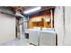 Laundry room featuring a utility sink, washer, and dryer, perfect for functionality at 921 S Wheeling St, Aurora, CO 80012