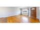 Spacious living room featuring wood floors, a window, and natural light at 921 S Wheeling St, Aurora, CO 80012