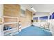Bright sunroom with brick wall, blue carpet, and many windows at 921 S Wheeling St, Aurora, CO 80012