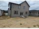 View of the home's backyard, featuring the home's siding and windows at 6065 Caribou Dr, Brighton, CO 80601