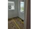 Corner bedroom bathed in natural light from two windows, offering views of the neighborhood at 6065 Caribou Dr, Brighton, CO 80601