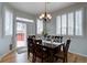 Elegant dining room with wood floors, plantation shutters, and access to outdoor deck at 16397 Sheridan Dr, Parker, CO 80134