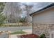 View of a home's side exterior near a fenced park with playground and picnic areas at 16397 Sheridan Dr, Parker, CO 80134