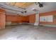 Spacious two-car garage with high ceilings, ample lighting, and pegboard wall at 16397 Sheridan Dr, Parker, CO 80134