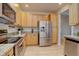 Charming kitchen featuring stainless steel appliances, granite countertops, and beautiful wood cabinets at 16397 Sheridan Dr, Parker, CO 80134