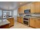Well-equipped kitchen with stainless steel appliances, granite countertops, and ample cabinet space at 16397 Sheridan Dr, Parker, CO 80134