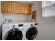 Laundry area includes a window and a modern white washer and dryer set at 16397 Sheridan Dr, Parker, CO 80134