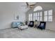 Sunlit living room with vaulted ceilings, plantation shutters, and neutral decor at 16397 Sheridan Dr, Parker, CO 80134