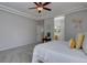 The bright main bedroom includes ensuite bathroom, ceiling fan, and walk-in closet at 16397 Sheridan Dr, Parker, CO 80134